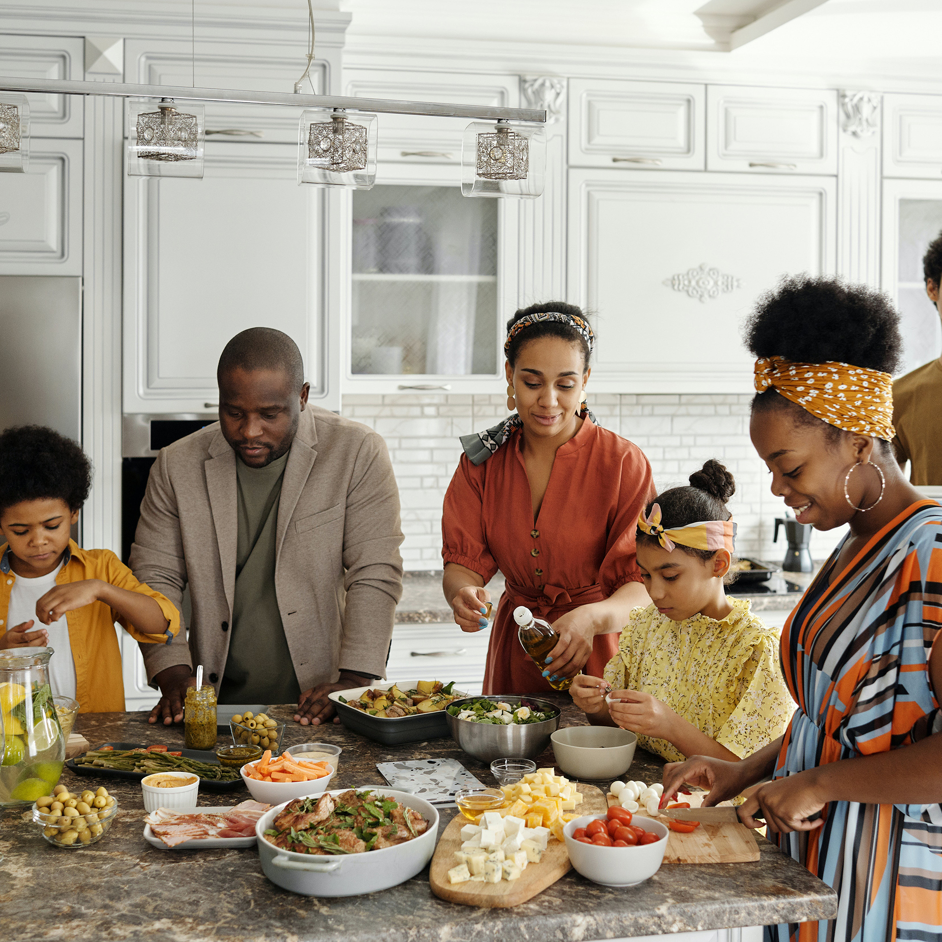 A family gathered in the kitchen